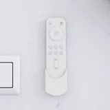 Large bathroom inspiration in Nordic style with bathroom furniture in light blue colour and wooden countertop with elegant countertop basin, herringbone wooden floor creating a bright and classic style