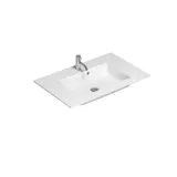 Stylish bathroom inspiration with beige vanity unit with inner drawer, upper cabinet, open shelf, oval mirror with lighting, matching pendants, shelf under the mirror, and wall-mounted toilet. Walls with light, elongated tiles