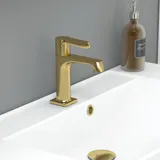 Large bathroom in green colors with vanity unit, brass framed oval mirror and beautiful framed doors