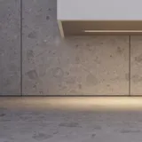 Large bathroom in green colors with vanity unit, brass framed oval mirror and beautiful framed doors