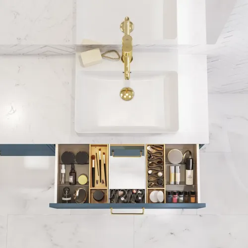 Bathroom inspiration with bathroom furniture in modern blue colour, elegant countertop basin and large square mirror with light, white herringbone tiles create a stylish and classic look