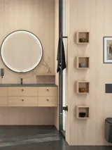 Stylish bathroom in Scandinavian and Japandi design with light wood walls, round mirror, and minimalist bathroom furniture