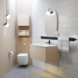 Stylish bathroom inspiration with beige vanity unit with inner drawer, upper cabinet, open shelf, oval mirror with lighting, matching pendants, shelf under the mirror, and wall-mounted toilet. Walls with light, elongated tiles