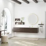 Nordic style bathroom inspiration with vanity unit and base cabinets in smoked oak, makeup area, side-mounted sink, round mirror with brass frame, and visible charming wooden beams