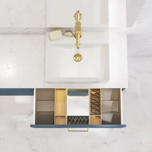 Bathroom inspiration with bathroom furniture in modern blue colour, elegant countertop basin and large square mirror with light, white herringbone tiles create a stylish and classic look