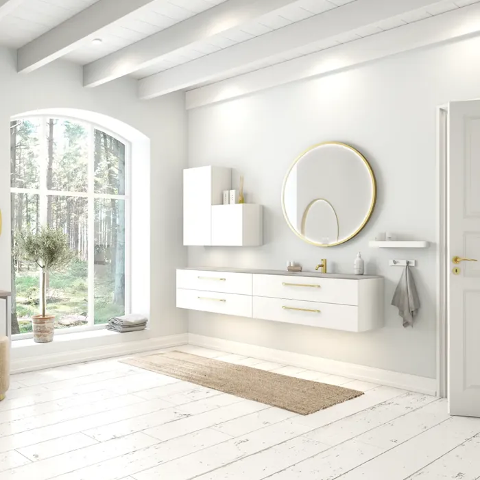 Large and romantic bathroom with brass framed round mirror