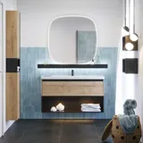 Bathroom inspiration with elongated blue tiles, natural oak bathroom furniture with black details, creating a harmonious and sophisticated look